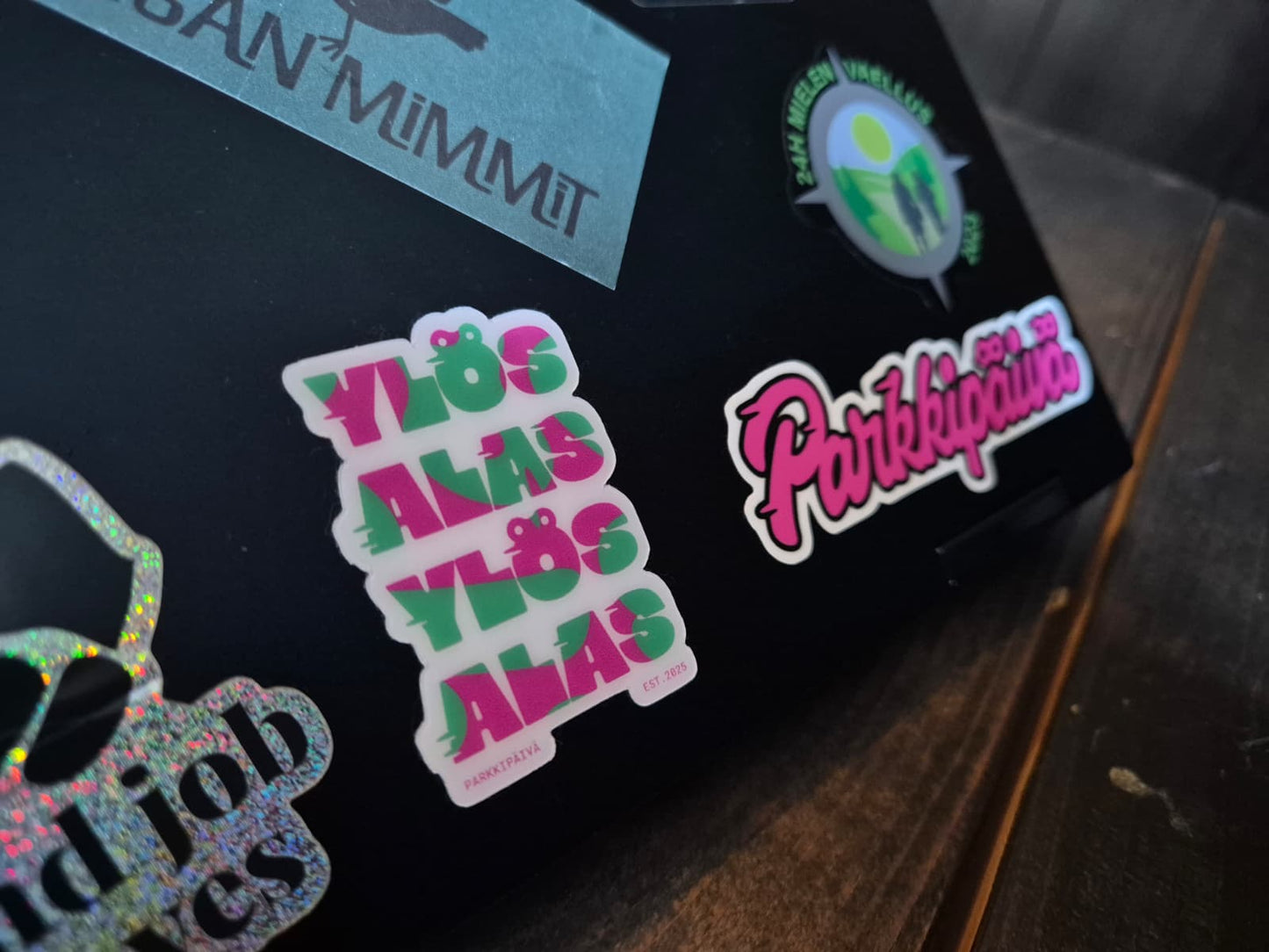 Parkipaiva and Ylos Alas sticker on Black Laptop