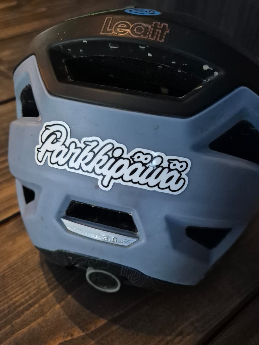 White Parkkipaiva sticker on helmet